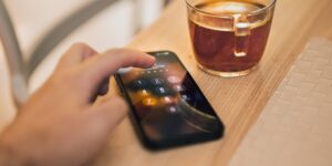 A smartphone on a coffee table representing digital security.
