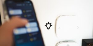A smart home energy management setup featuring a smartphone and modern appliances.