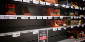 A conceptual view of grocery store shelves representing the global supply chain.