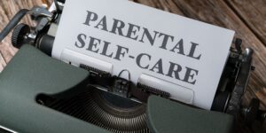 A parenting toolkit for emotional regulation on a wooden table.