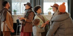 A group of parents socializing in a modern, welcoming community space designed for families.