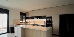 A sleek, modern setup showing an open-hardware water sensor integrated into a home plumbing system.