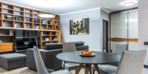 A cozy, well-lit home-schooling corner with restored wooden furniture.