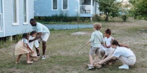 A group of neighborhood children gathered in a backyard for a community activity.