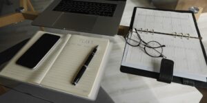 A modern home office setup for a digital nomad planning their global tax strategy.