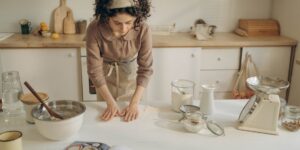 A rustic home bakery setup on a sunny kitchen counter.