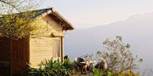 A peaceful mountain retreat at sunrise representing quiet tourism.