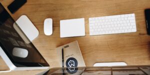 A clean, organized digital workspace on a wooden desk.