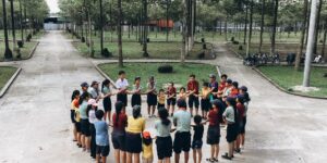 Neighbors gathering in a park to organize a community skill-sharing group.