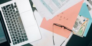 A clean, organized home office desk representing financial management.