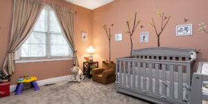 A calm, neutral-toned child's bedroom designed for relaxation and sensory regulation.
