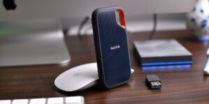 A minimalist setup featuring an external hard drive and a smartphone for digital backup.