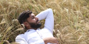 A professional in their 30s taking a quiet moment of reflection to plan a work break.