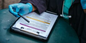 A professional view of travel documents and medical tools representing the global healthcare landscape.