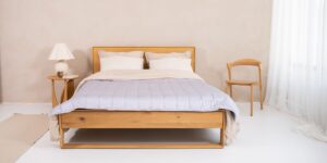 A serene, minimalist hotel bedroom designed for deep rest.