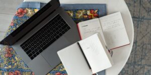 A organized, modern kitchen table setup representing the planning phase of hosting an exchange student.